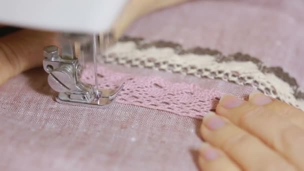 Sewing on the sewing machine, closeup. womans hand seamstress — Stock Video