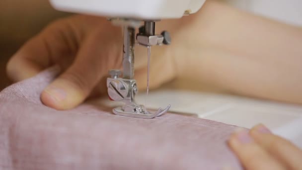 Sewing on the sewing machine, closeup. womans hand seamstress — Stock Video