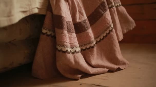 Girl measures the long skirt made of linen — Stock Video