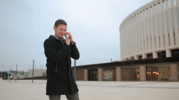 Russia. Krasnodar. 13 02 2017 Man in coat with phone — Stock Video