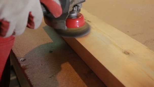 Carpenter grinds board grinding machine. close-up — Stock Footage Carpenter grinds board grinding machine. close-up Royalty Free Stock Video