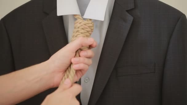 Businessman adjusting a noose rope like tie, going on not your favorite job, — Stock Video