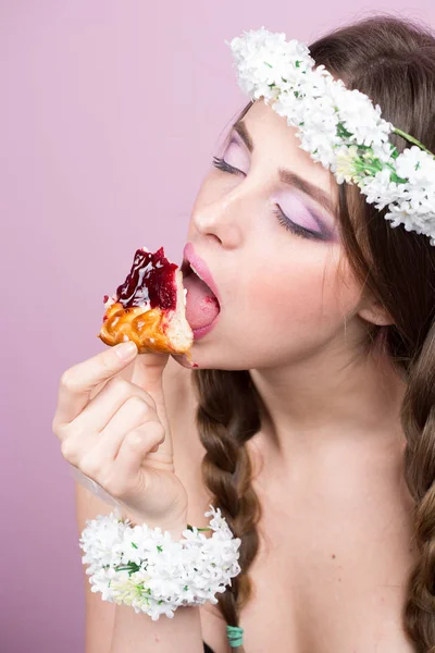 Young model with bright flowers on her head — Stock Photo, Image