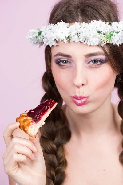 Young model with bright flowers on her head — Stock Photo, Image