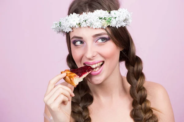 Young model with bright flowers on her head — Stock Photo, Image