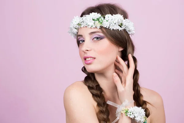 Young model with bright flowers on her head — Stock Photo, Image