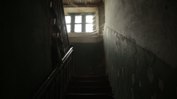 The terrible old eerie windows of the old house are all in a cobweb. inside view — Stock Video