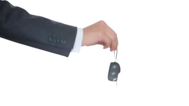 Male hand holding a car key and handing it over to another person. shake hands — Stock Video