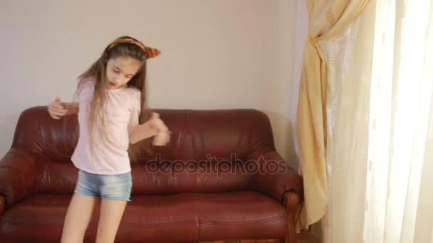 Little cute girl dancing and fooling around at home — Stock Video