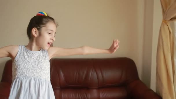 Little cute girl dancing and fooling around at home — Stock Video