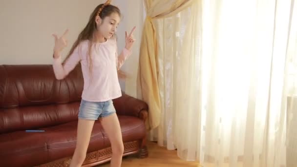 Little cute girl dancing and fooling around at home — Stock Video