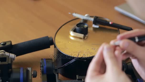 Close up of mans soldering wires of cpu — Stock Video