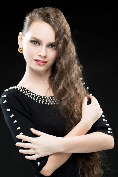 Beautiful woman with dark hair and evening makeup. sexy black dress — Stock Photo, Image