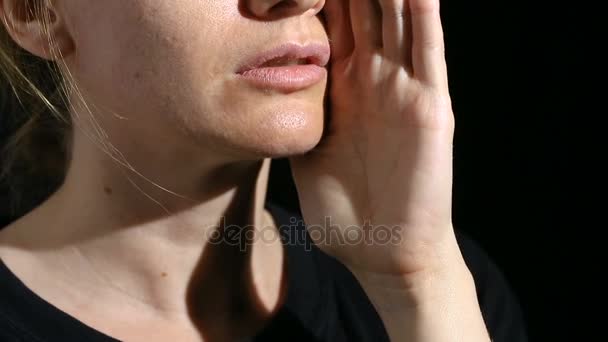 A person whisper into the camera. Close-up of the lips. whisper On a black background — Stock Video