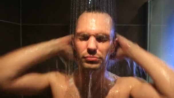 Tired man washes in the shower. He did not get enough sleep — Stock Video