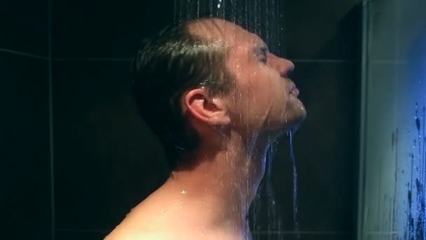 Tired man washes in the shower. He did not get enough sleep — Stock Video