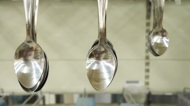 4k. Slow motion. Spoons on the counter in the supermarket close-up. — Stock Video