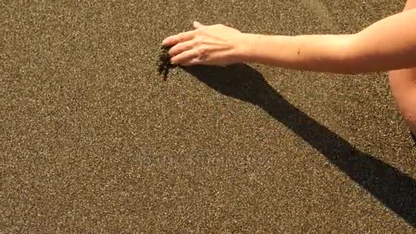 Female hand Drawing the heart on the wet sand. 4k slow motion — Stock Video