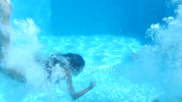 Children swim under water. 4k. Slow motion — Stock Video