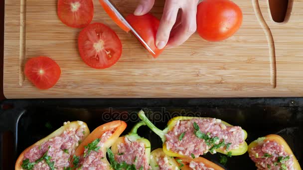 Womens hands preparing zucchini stuffed with minced meat and Bulgarian peppers. 4k, top view. — Stock Video