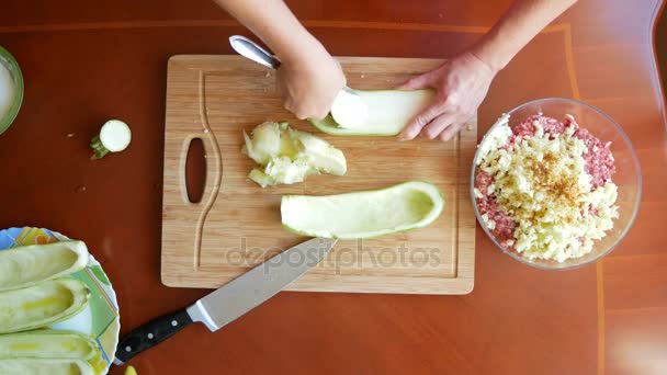 Womens hands preparing zucchini stuffed with minced meat and Bulgarian peppers. 4k, top view. — Stock Video