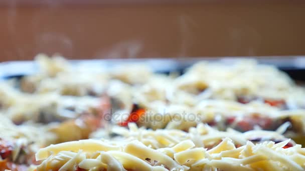 Steaming, hot, freshly baked, stuffed zucchini on a baking sheet. close-up of steam from a hot dish. 4k, slow-motion — Stock Video