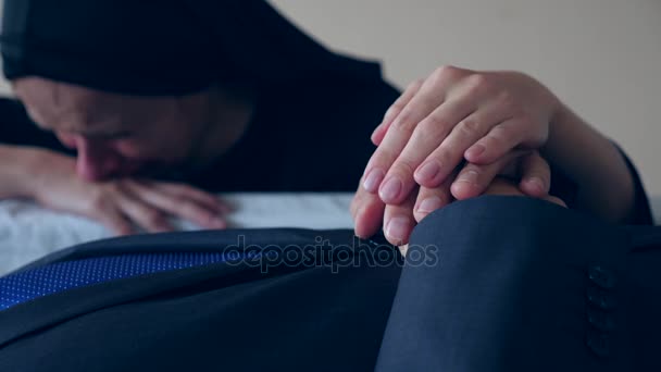 Funeral, sadness and mourning concept - sad woman talking and crying next to the coffin. 4k, — Stock Video