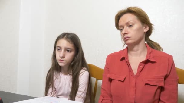 Mother and daughter working on a homework together on a laptop. online learning, online school. 4k. — Stock Video