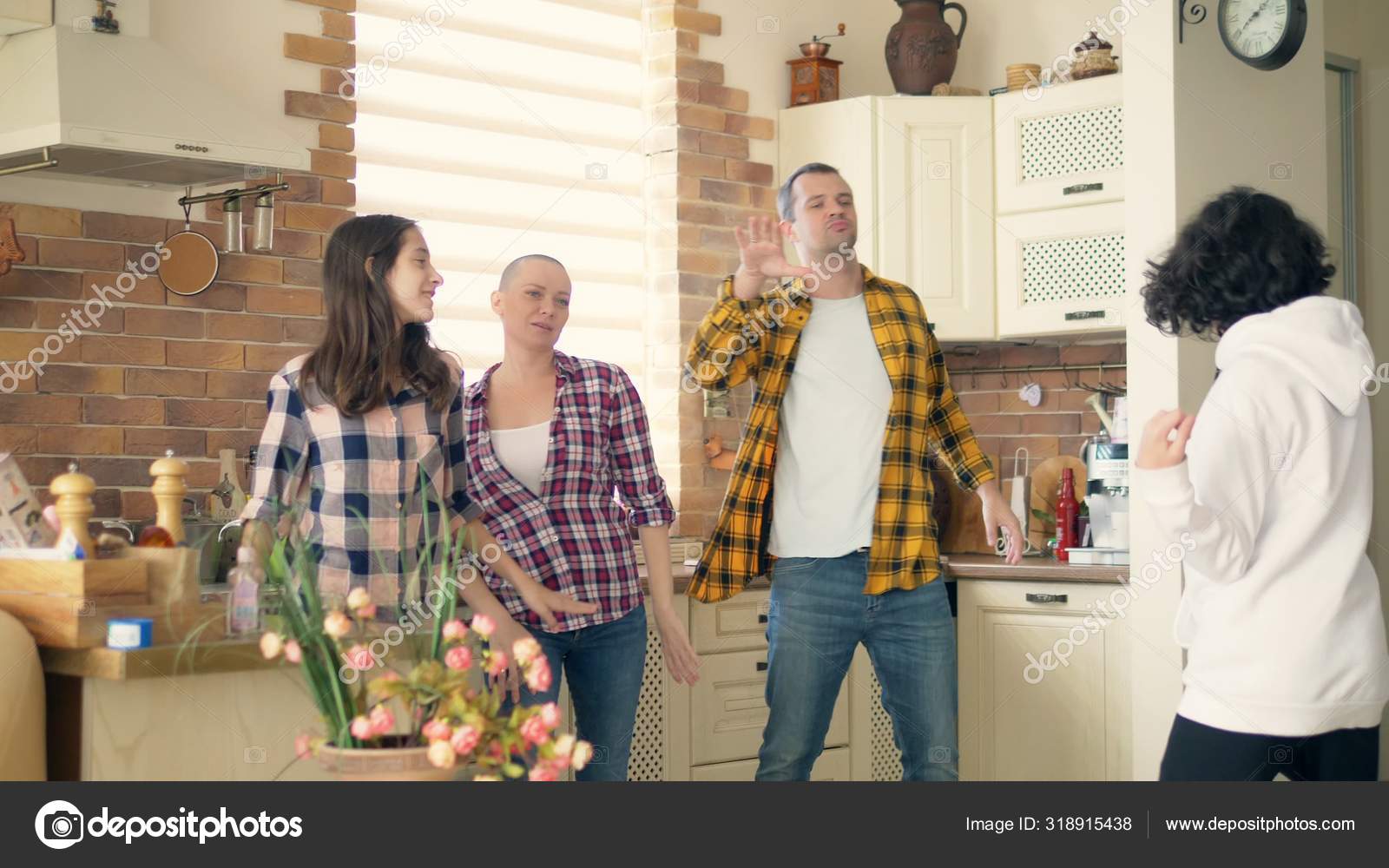 A Bald Woman Spends Time With Her Family Husband Wife Boy And Girl Twins Teens Dance And Laugh Together In The Kitchen Stock Photo Image By C Kopitin A Bald Woman Spends Time With Her Family Husband Wife Boy And Girl Twins Teens Dance And Laugh Together In The Kitchen Stock Photo Image By C Kopitin
