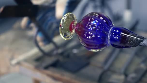 Glassblower. manufacturer of glass shots in glass workshop — Stock Video