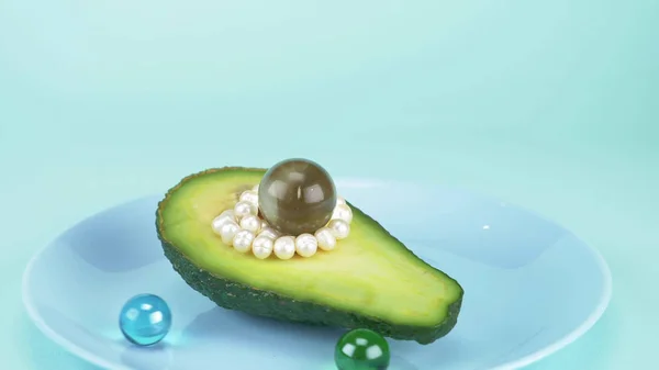 Mode design mat. en halv avokado med pärlor, glasboll, konfetti — Stockfoto