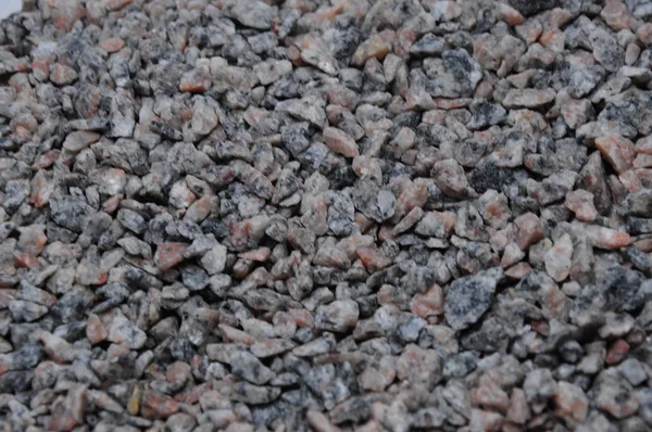 細かい石 小さな砕石 灰色と多色の小石の背景 — ストック写真