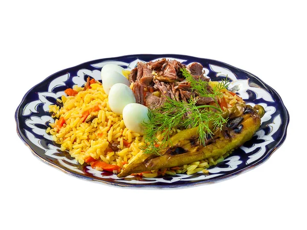 Pilavı sebze ve yumurta ile. Geleneksel Özbek mutfağı, Orta Doğu, Asya.