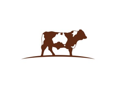 Kahverengi bir ineğin logosu eğri ufukta duruyordu. Avustralya haritası derisinin her yerinde negatif bir boşluk olarak duruyordu.