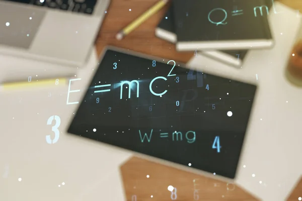 Physical formulas on the background of a table with a digital tablet, papers and laptop, double exposure. Education concept — Stock Photo, Image