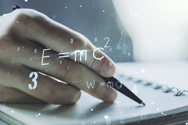 Creative scientific formula concept with man hand writing in notebook on background. Multiexposure — Stock Photo, Image