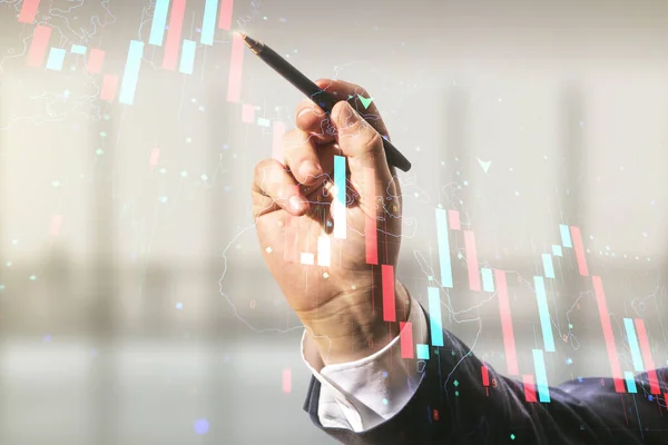 Man hand with pen working with abstract virtual global crisis chart and world map sketch on blurred office background, falling markets and collapse of global economy concept. Double exposure