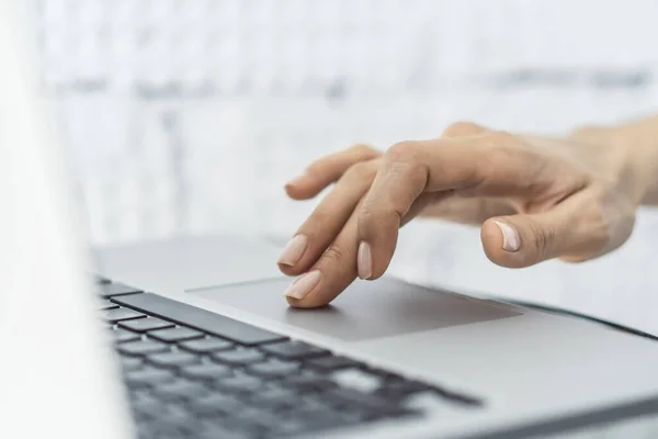 Woman working with laptop, business and technology concept. Close up