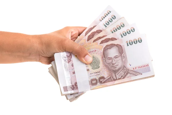 Hand geven van Thaise bankbiljetten. Studio schot geïsoleerd op witte backgr — Stockfoto