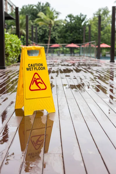 Wet floor warning sign on the floor in hotel corridor — Stock Photo, Image