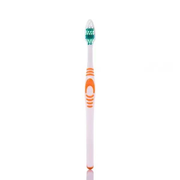 Neue orangene Zahnbürste. Studioaufnahme isoliert auf Weiß — Stockfoto