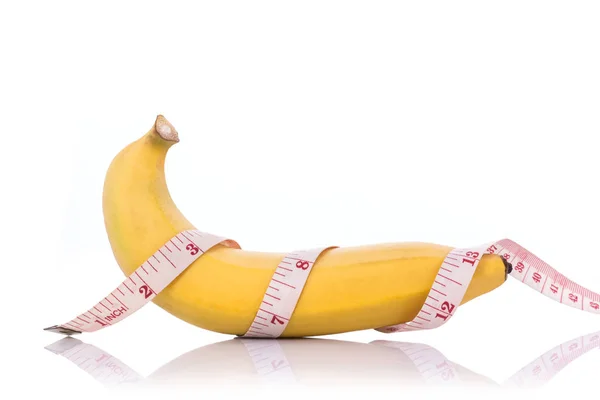 Gelbe Banane mit Maßband. Männer Penisgröße Konzept — Stockfoto