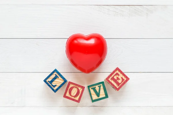 Top view red heart on white wooden plank. For love or valentine — Stock Photo, Image