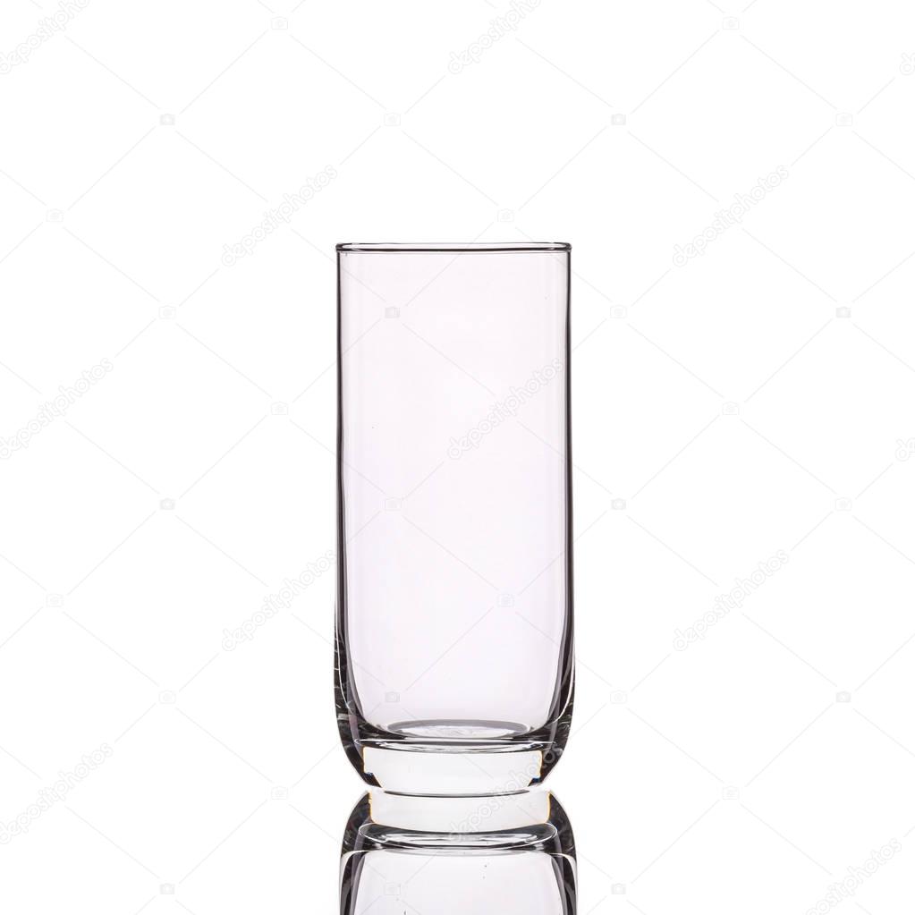 Empty clear drinking glass. Studio shot isolated on white 