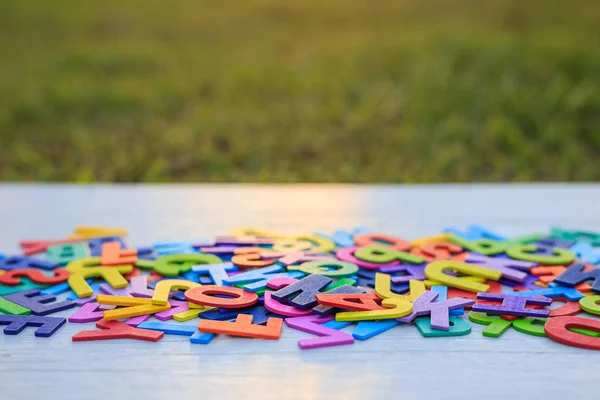 Colorful wooden alphabet. Top view on white wooden — Stock Photo, Image