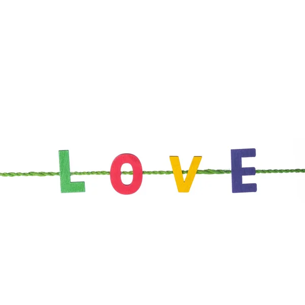 Alfabeto di legno colorato e parola LOVE. Studio girato isolato su — Foto Stock