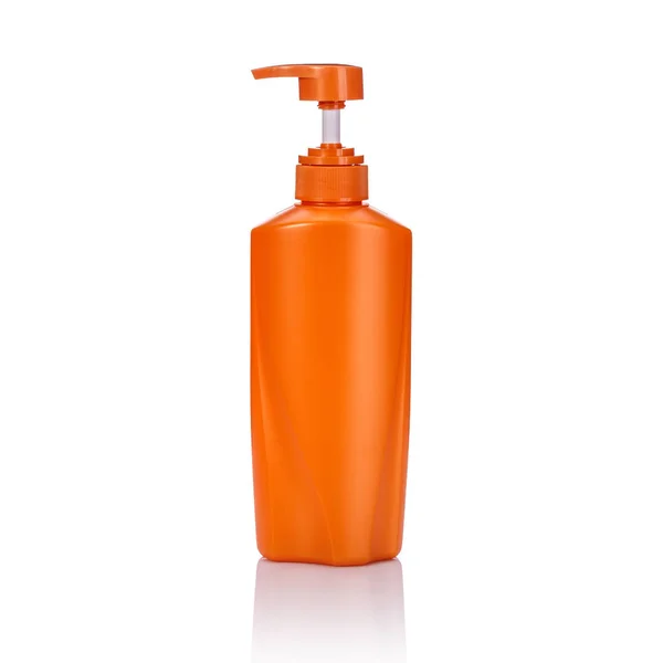 Frasco de bomba de plástico laranja em branco usado para shampoo ou sabão. Studi... — Fotografia de Stock
