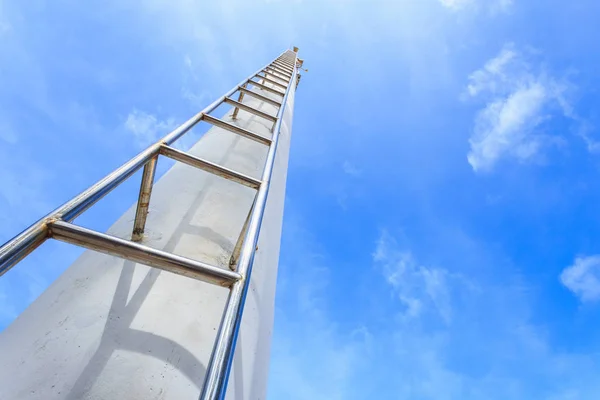 High steel ladder on clear blue sky background — Stock Photo, Image