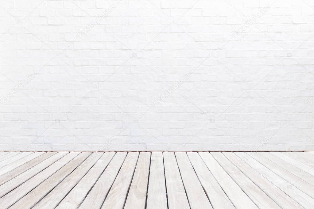 Exterior wooden decking floor and white brick wall. Abstract dec