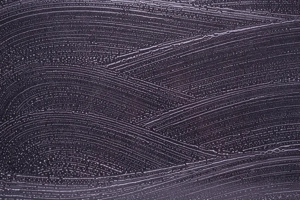 Piso de piedra negro limpieza del suelo con burbujas de jabón blanco en la parte superior — Foto de Stock